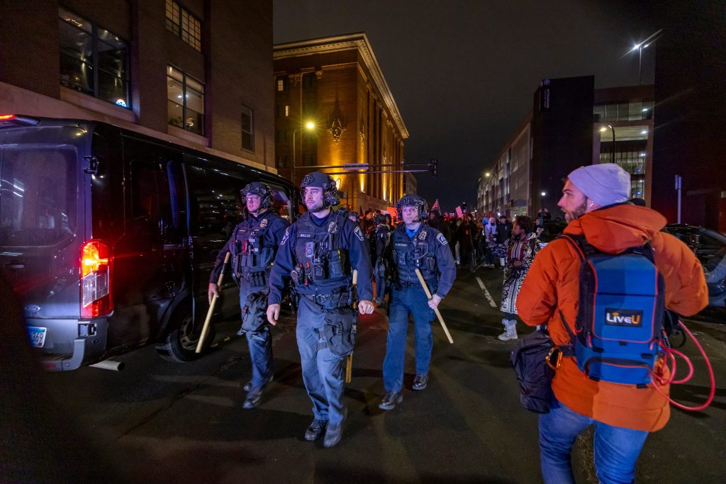 Demonstrators make noise outside of hotels thought to house U.S. Immigration and Customs Enforcement and other federal agents in Minneapolis on Jan 9. An ICE officer fatally shot a woman during a confrontation in Minneapolis, sparking an uproar over the presence of agents in the city and heightening political divisions around the Trump administration's migrant crackdown.
