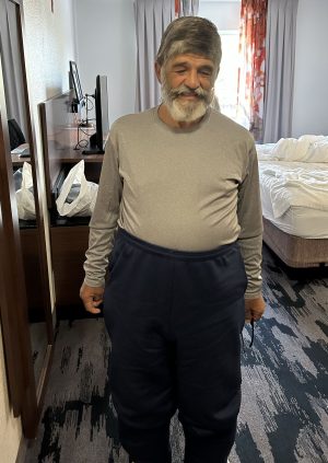 The Memorial Church of Christ in Houston rents a hotel room to give Maurice Costabile a shower.