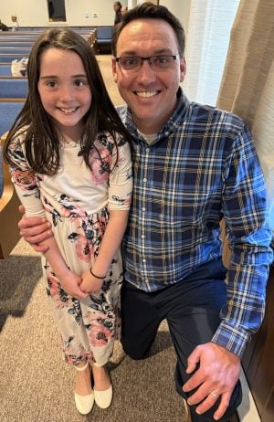 Daniel Niehls, pictured with his 9-year-old daughter, Penelope, serves as a deacon of the Cornerstone Church of Christ in Pottstown, Pa.