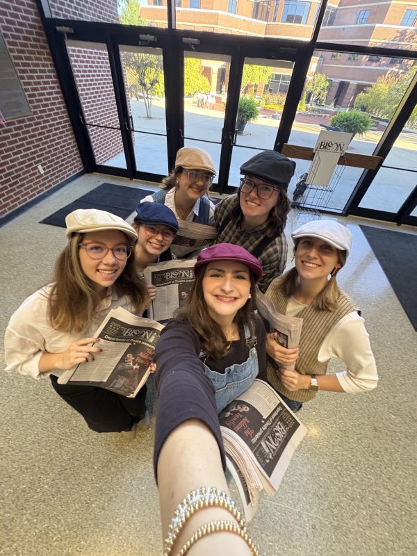 The Bison staff take a selfie while dressed up as Newsies for Halloween.