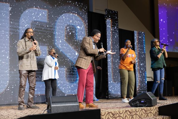 The Renaissance Church of Christ praise team leads Nehemiah summit attendees in singing. Renaissance is a cappella.