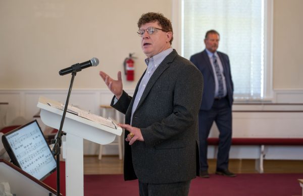 Dale Denny leads a hymn during worship. 