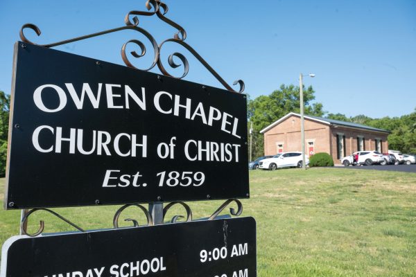 The Owen Chapel Church of Christ sign on Franklin Road displays service times. 