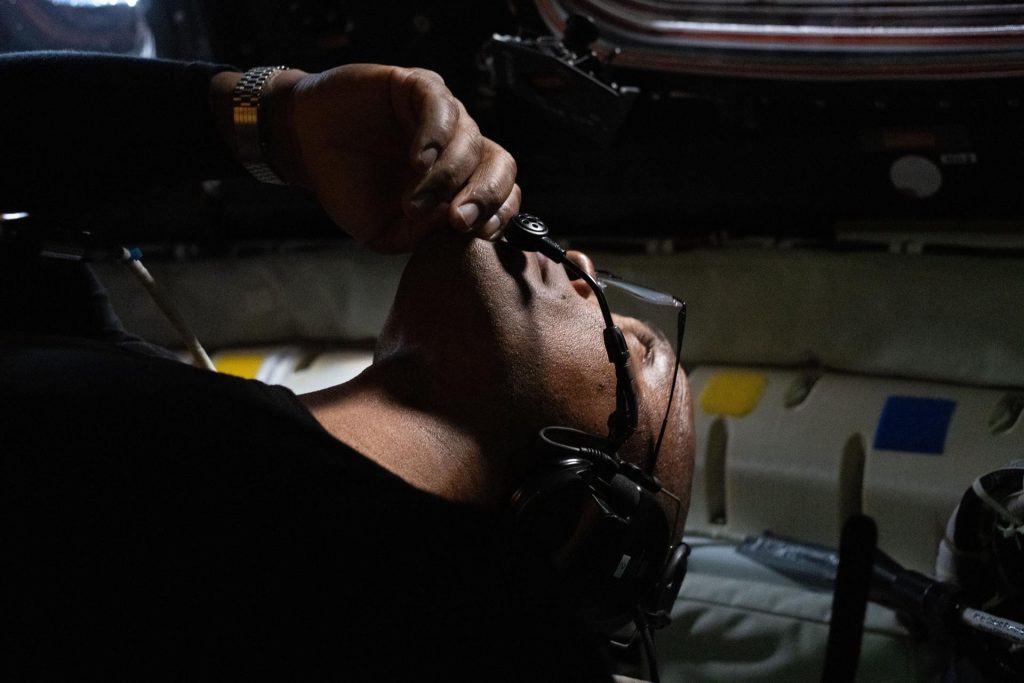 NASA astronaut and Artemis II Pilot Victor Glover observes his surroundings in the Orion spacecraft during the Artemis II lunar flyby.