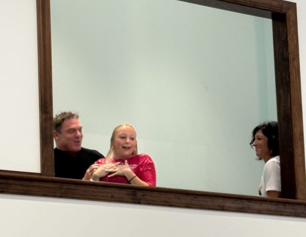 Pedro Delgado baptizes Ariana Boyd as Kelly Smyth watches at the Cornerstone Church of Christ in Pottstown, Pa.