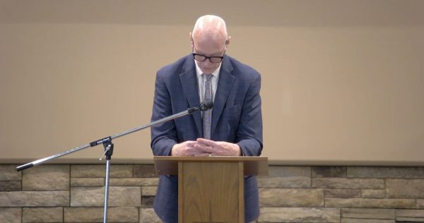 Elder Ron Delamarter prays at the Richfield Church of Christ in a Minneapolis suburb.