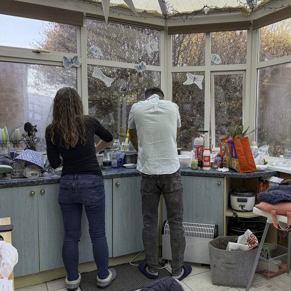 Iranian and American Christians prepare a meal at a missionary's home near Birmingham, England.