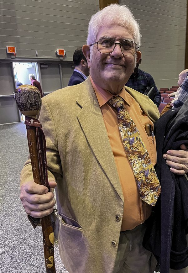 Don Reel shows his walking staff between sessions at the FHU Spiritual Growth Workshop.