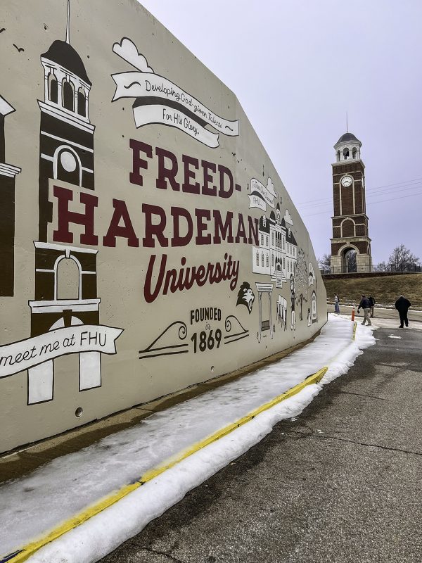 Attendees carefully make their way from the parking lot to the auditorium at Freed-Hardeman University.
