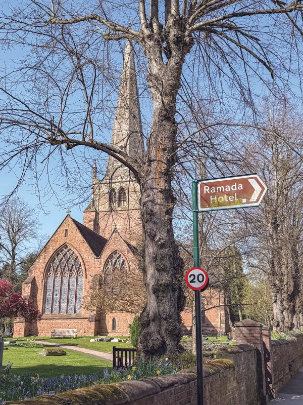 A sign points to the Ramada Hotel, a temporary home for many Iranian refugees in England.